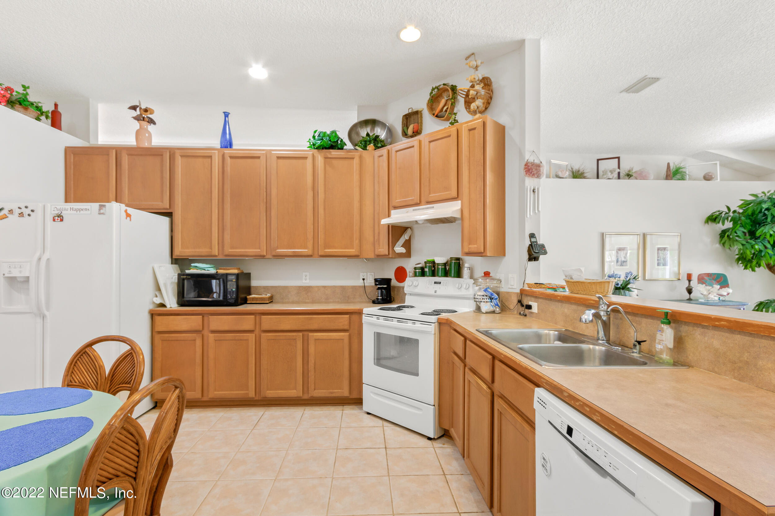 1304 Paradise Pond Road St. Augustine, FL 32092 - Photo 21 of 48 a kitchen with a sink appliances and cabinets