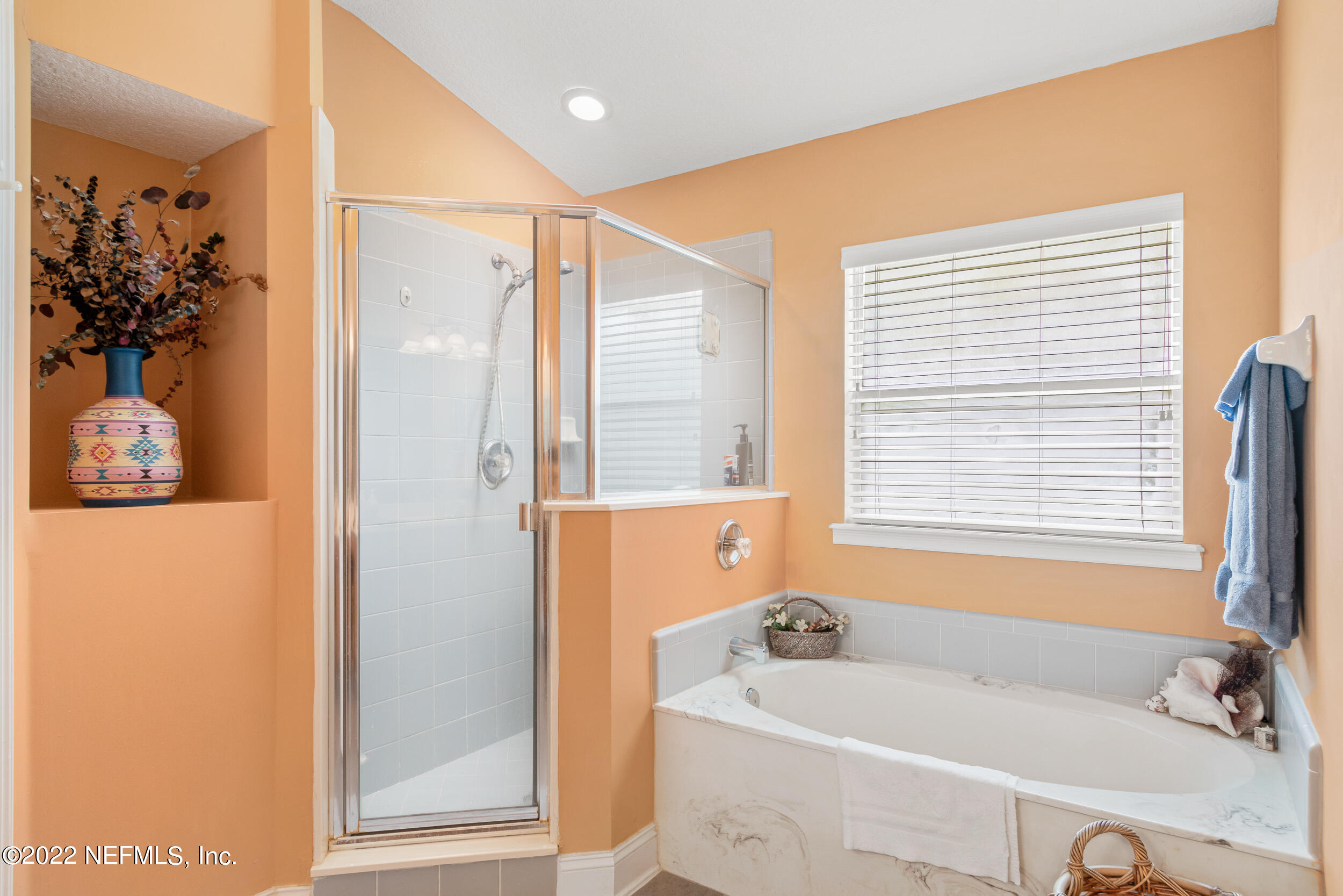 1304 Paradise Pond Road St. Augustine, FL 32092 - Photo 28 of 48 a bathroom with a tub a sink and a window