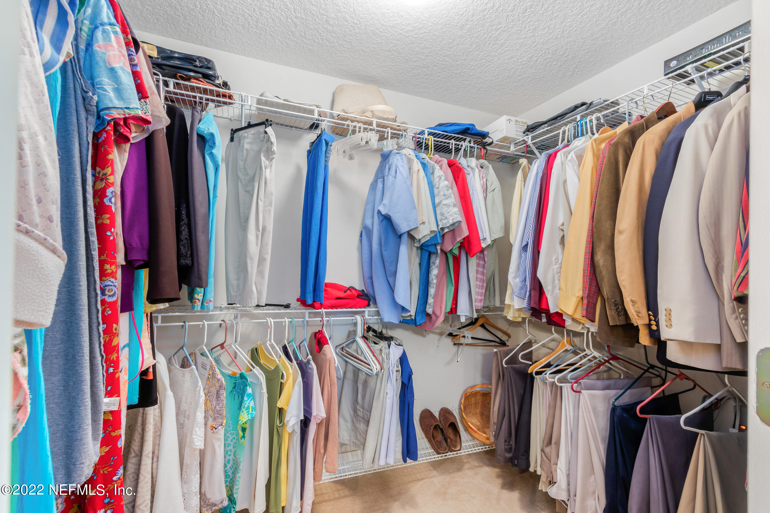 1304 Paradise Pond Road St. Augustine, FL 32092 - Photo 29 of 48 a view of walk in closet with clothes