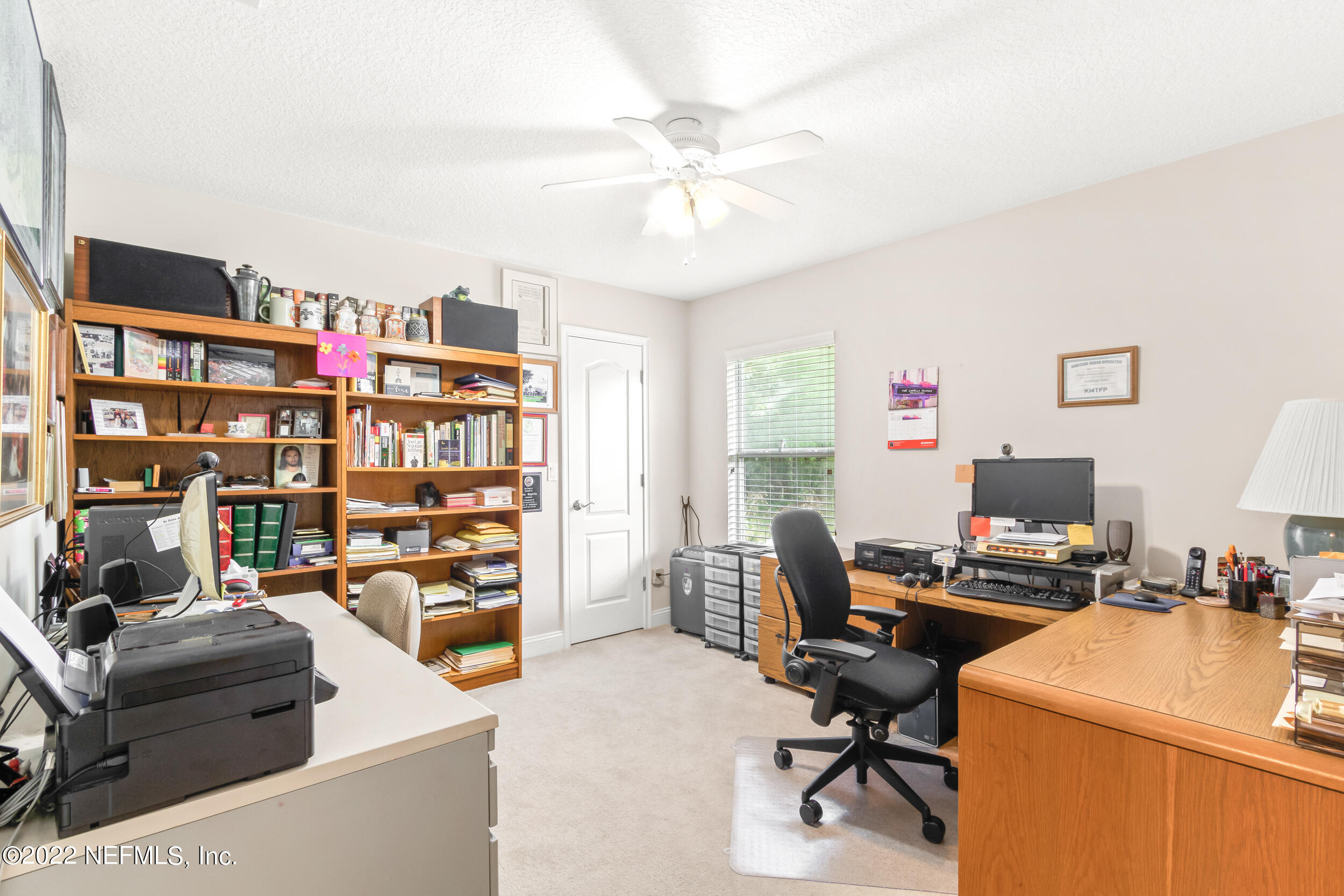 1304 Paradise Pond Road St. Augustine, FL 32092 - Photo 33 of 48 a work room with furniture and a book shelf