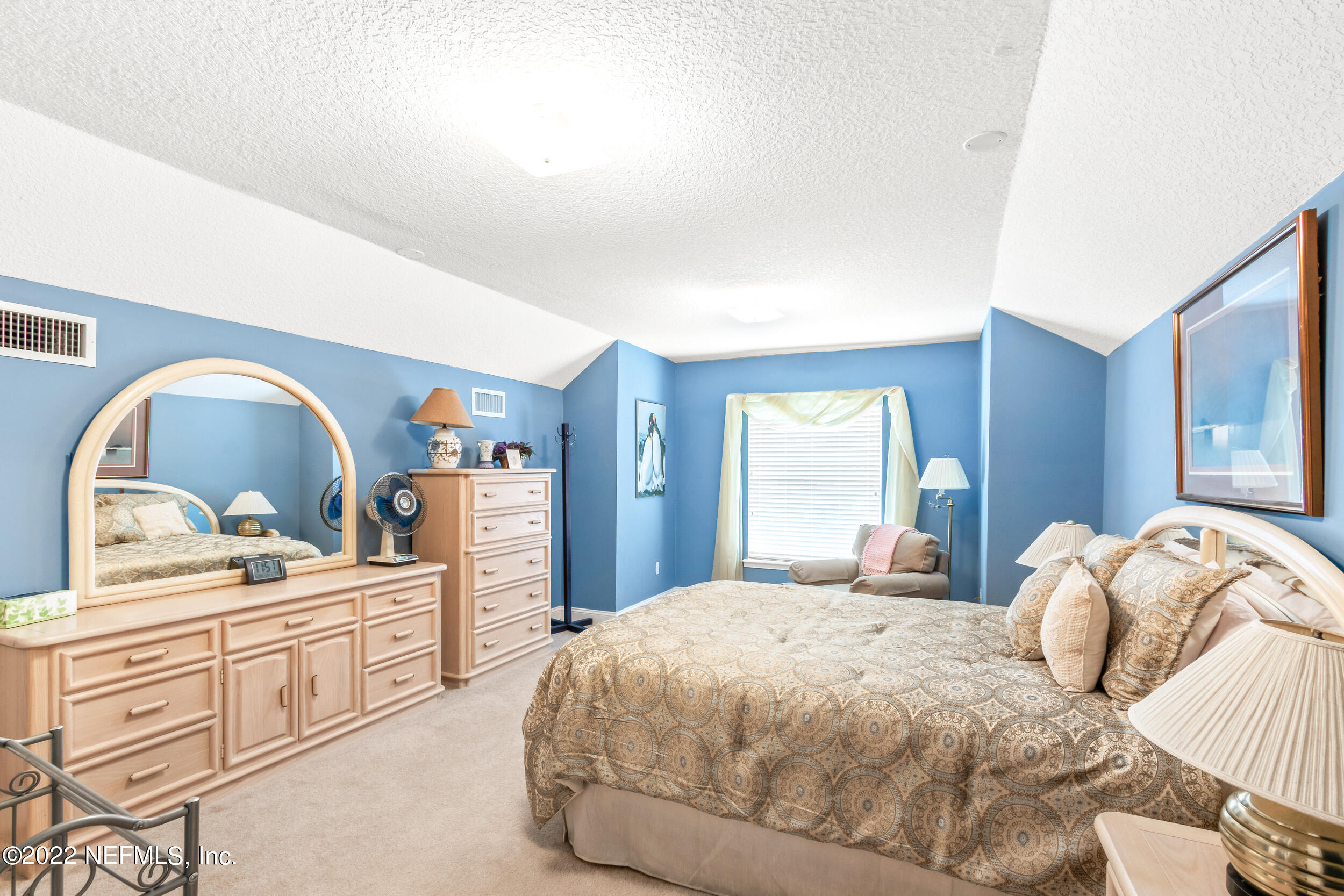 1304 Paradise Pond Road St. Augustine, FL 32092 - Photo 37 of 48 a bedroom with a bed and a dresser