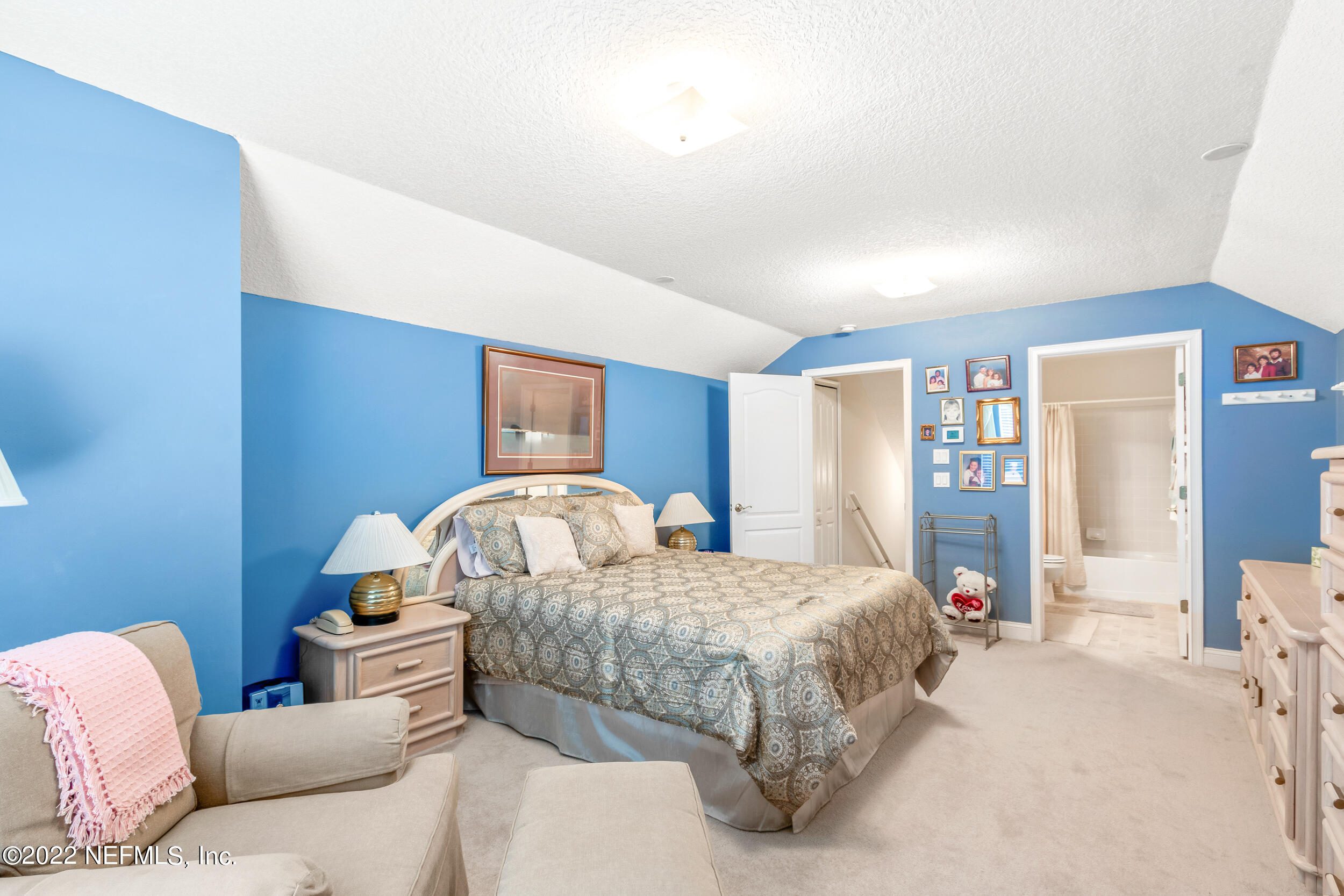 1304 Paradise Pond Road St. Augustine, FL 32092 - Photo 38 of 48 a bedroom with a bed and dresser