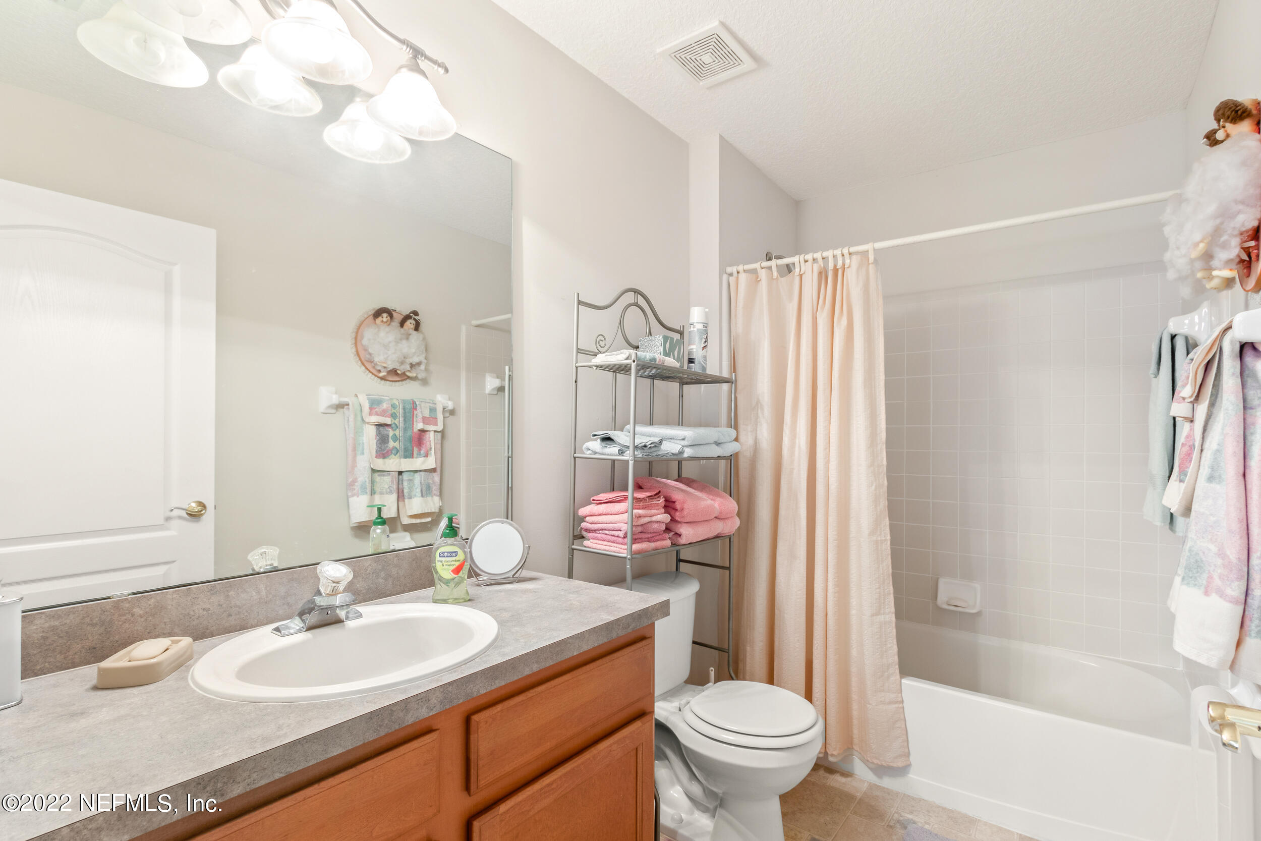 1304 Paradise Pond Road St. Augustine, FL 32092 - Photo 39 of 48 a bathroom with a granite countertop sink toilet and shower