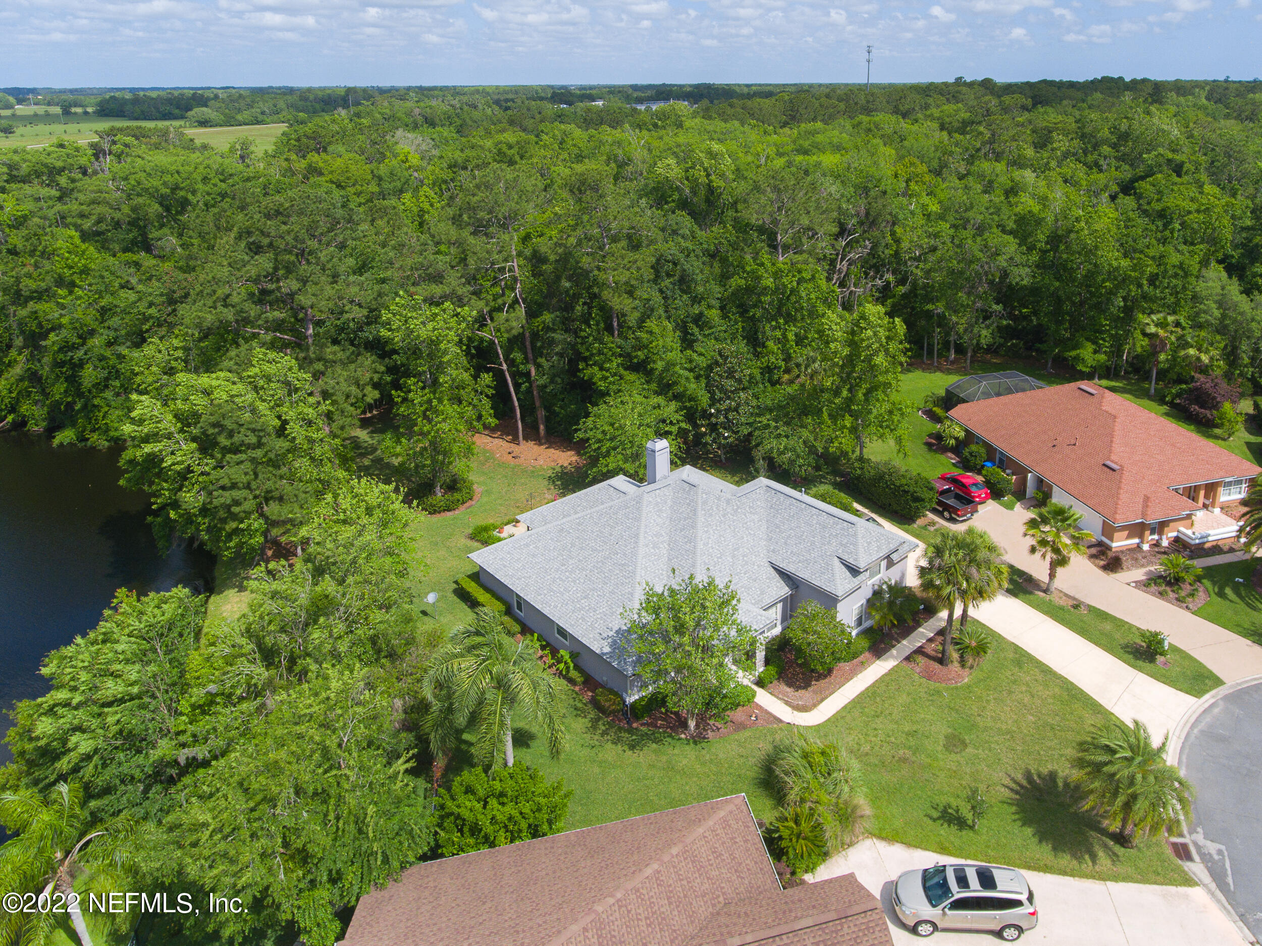 1304 Paradise Pond Road St. Augustine, FL 32092 - Photo 6 of 48 an aerial view of a house with a yard
