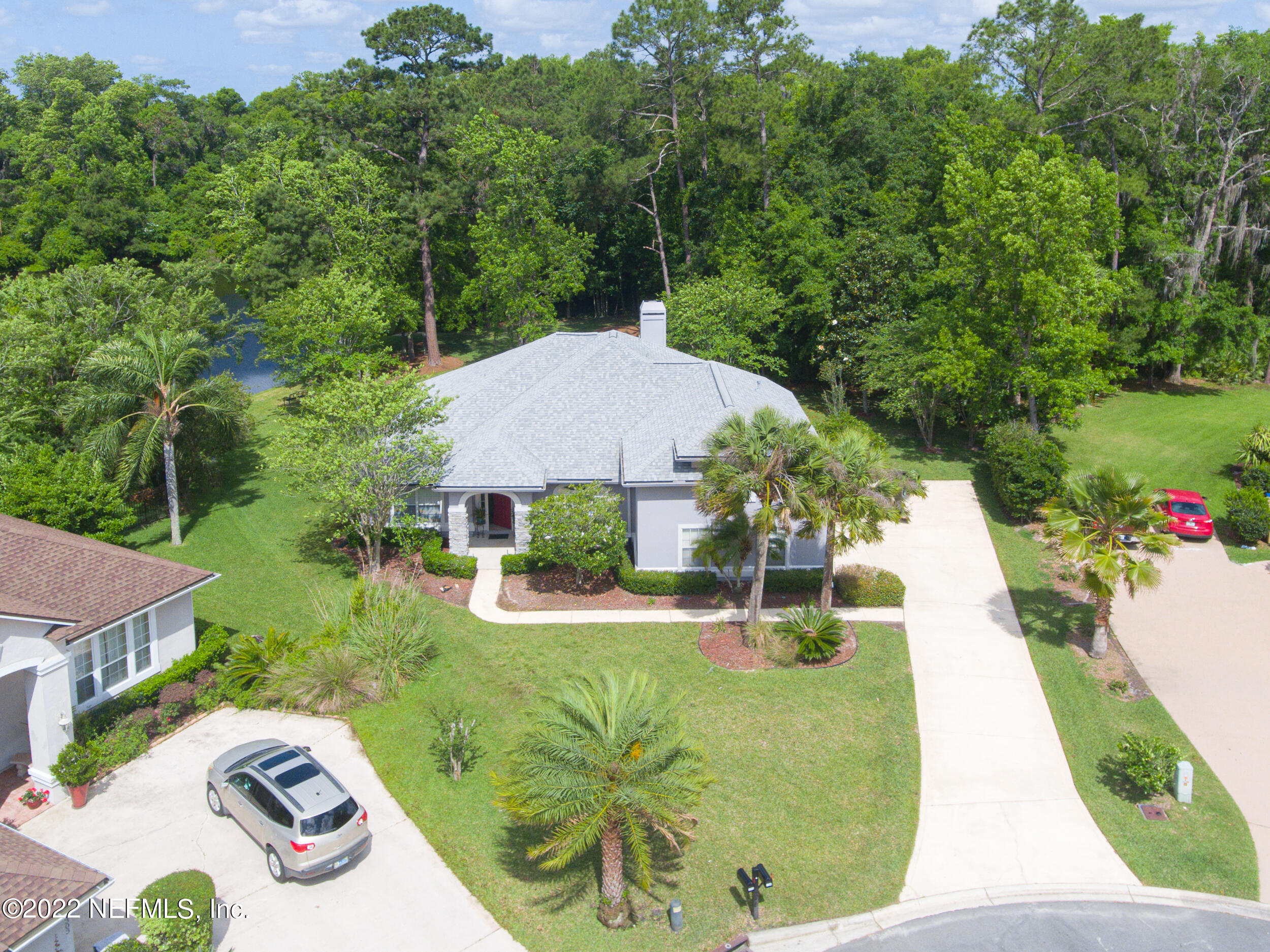 1304 Paradise Pond Road St. Augustine, FL 32092 - Photo 8 of 48 a view of a backyard with potted plants
