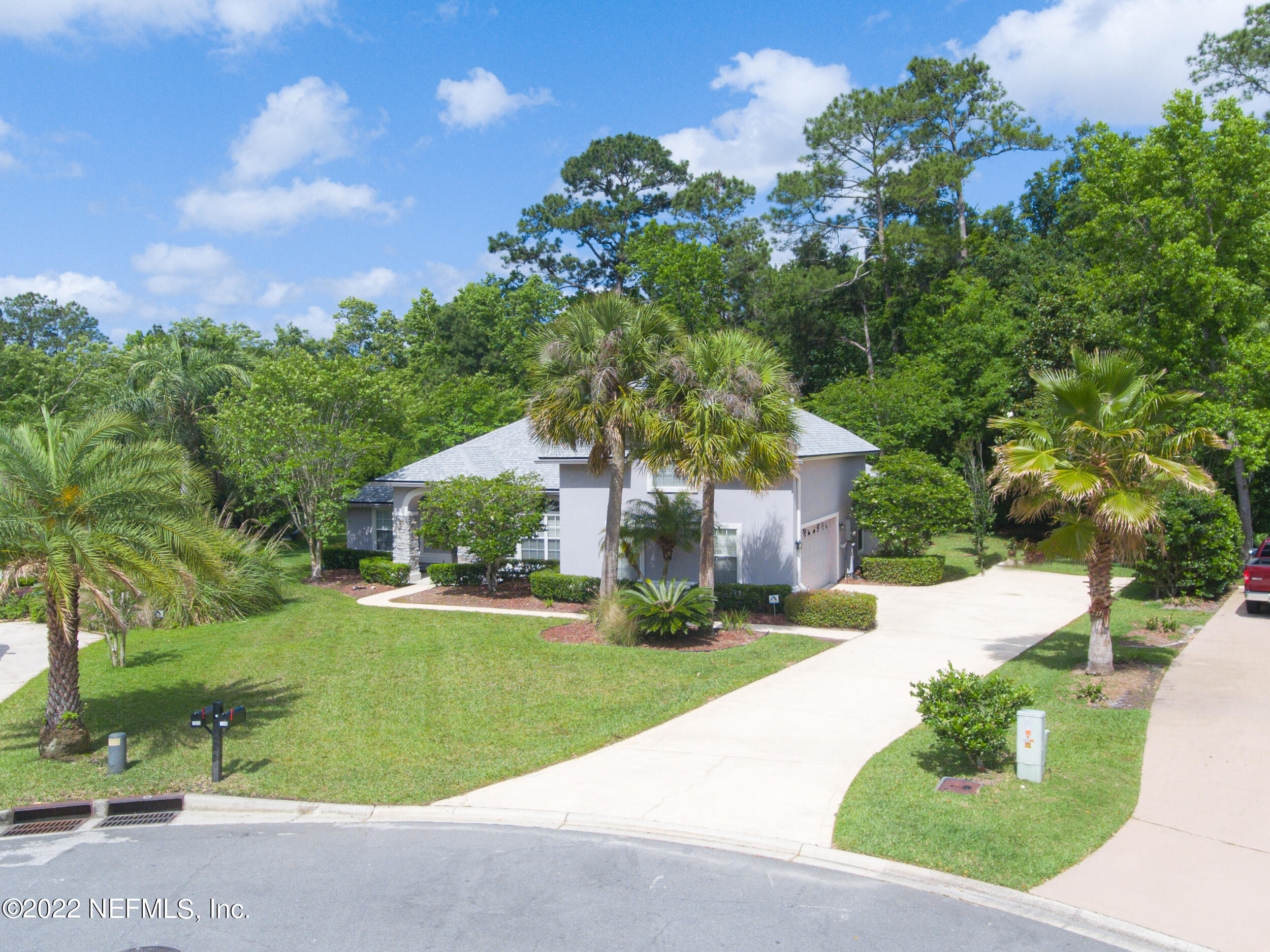 1304 Paradise Pond Road St. Augustine, FL 32092 - Photo 10 of 48 a front view of a house with a yard and garage