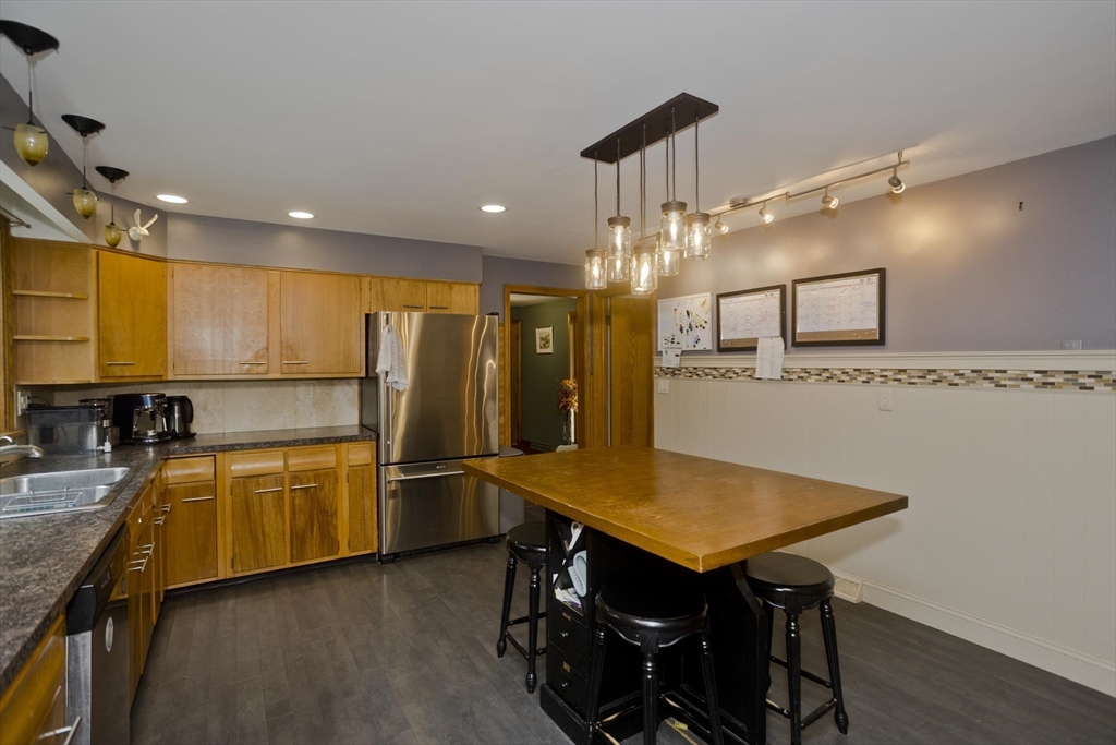 58 Longfellow Road Holyoke, MA 01040 - Photo 18 of 39 a kitchen with stainless steel appliances granite countertop a sink a stove and refrigerator