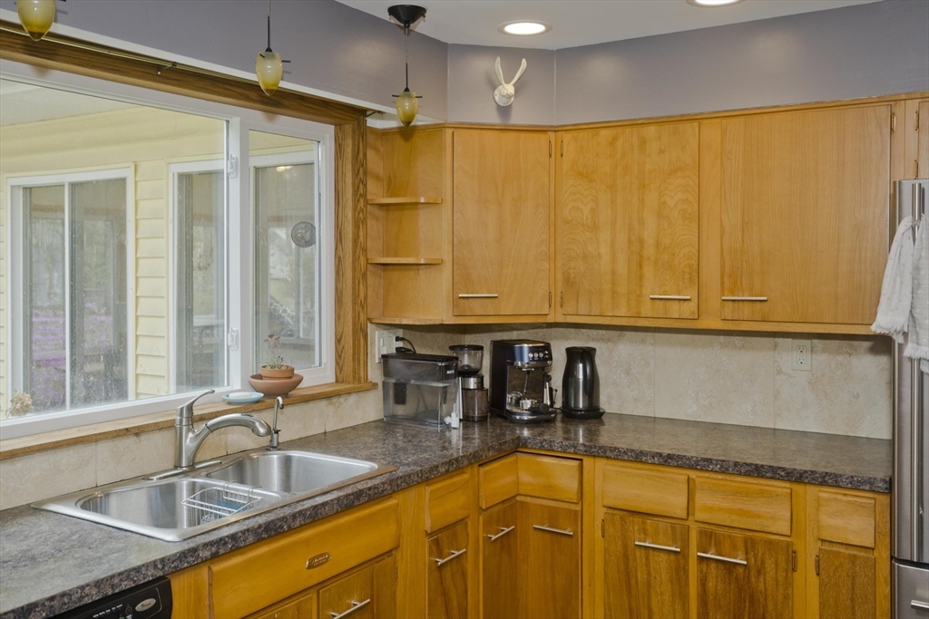 58 Longfellow Road Holyoke, MA 01040 - Photo 20 of 39 a bathroom with a sink and a large mirror