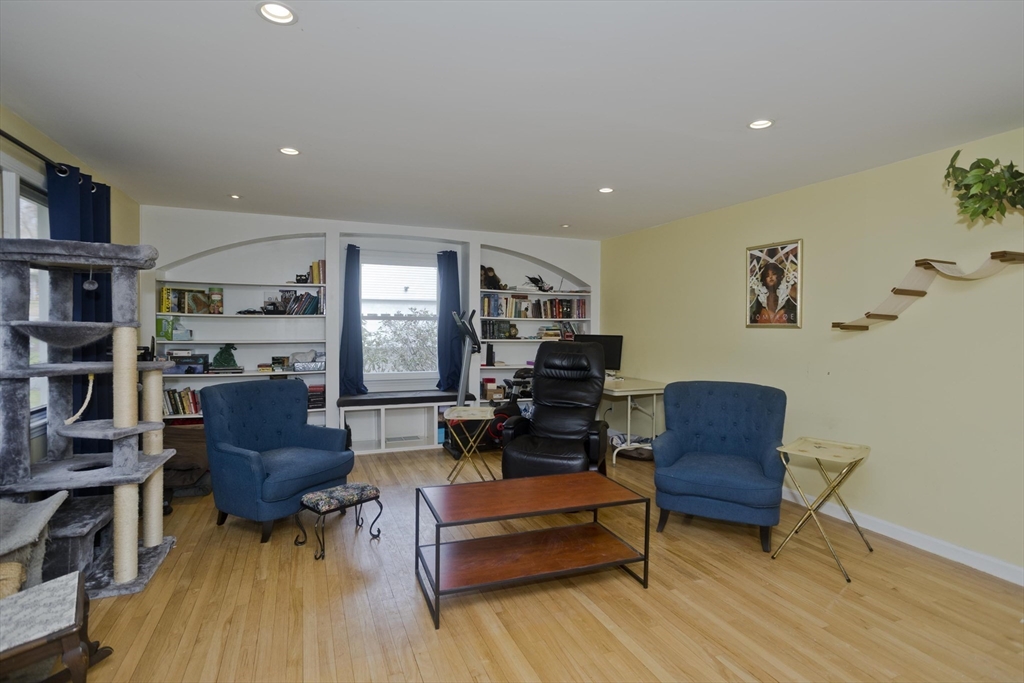 58 Longfellow Road Holyoke, MA 01040 - Photo 24 of 39 a living room with furniture and a wooden floor