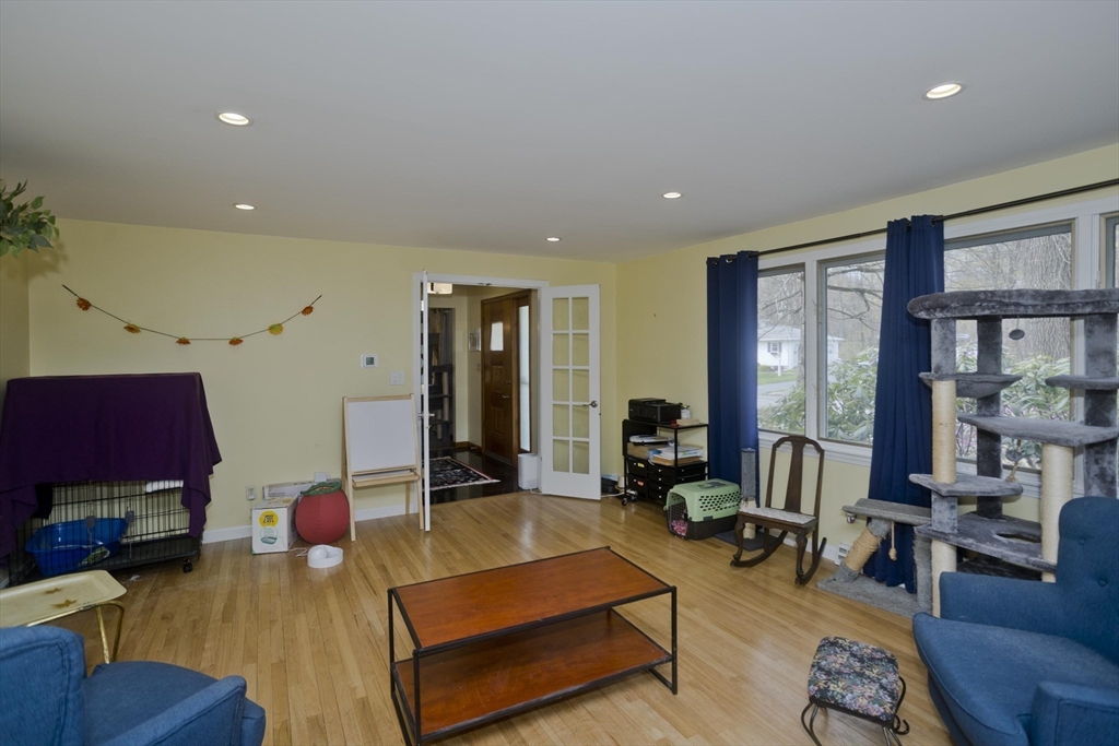 58 Longfellow Road Holyoke, MA 01040 - Photo 26 of 39 a living room with furniture and a wooden floor
