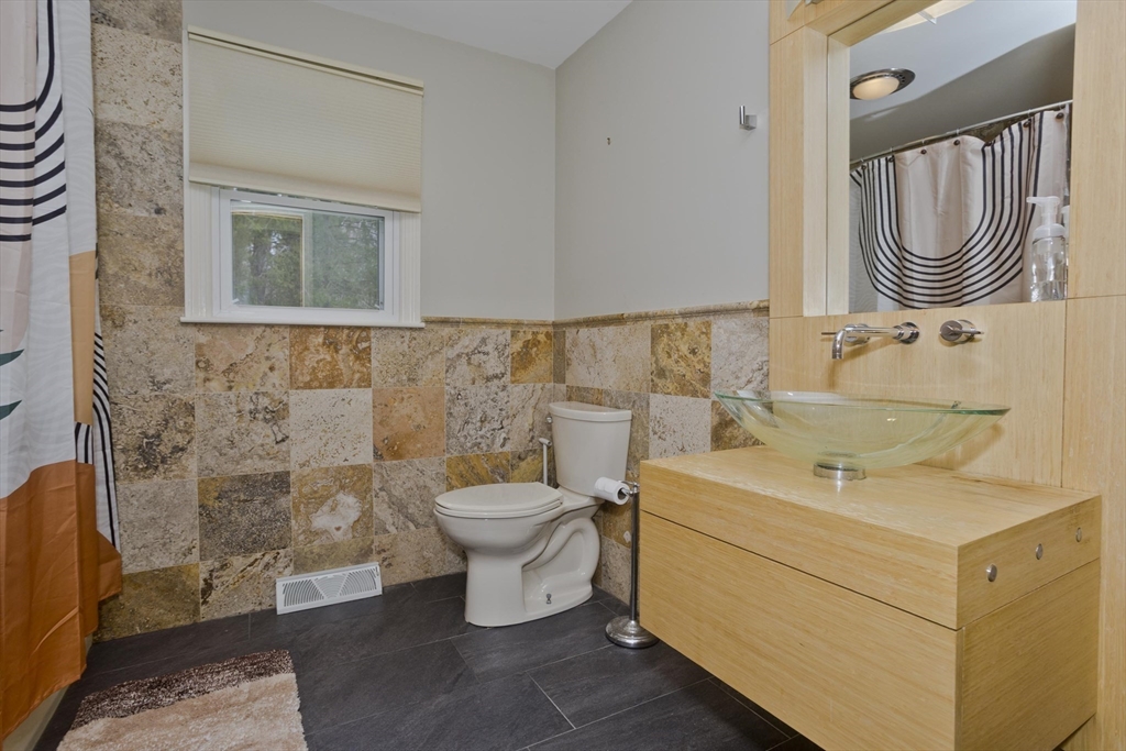 58 Longfellow Road Holyoke, MA 01040 - Photo 29 of 39 a bathroom with a sink toilet and mirror