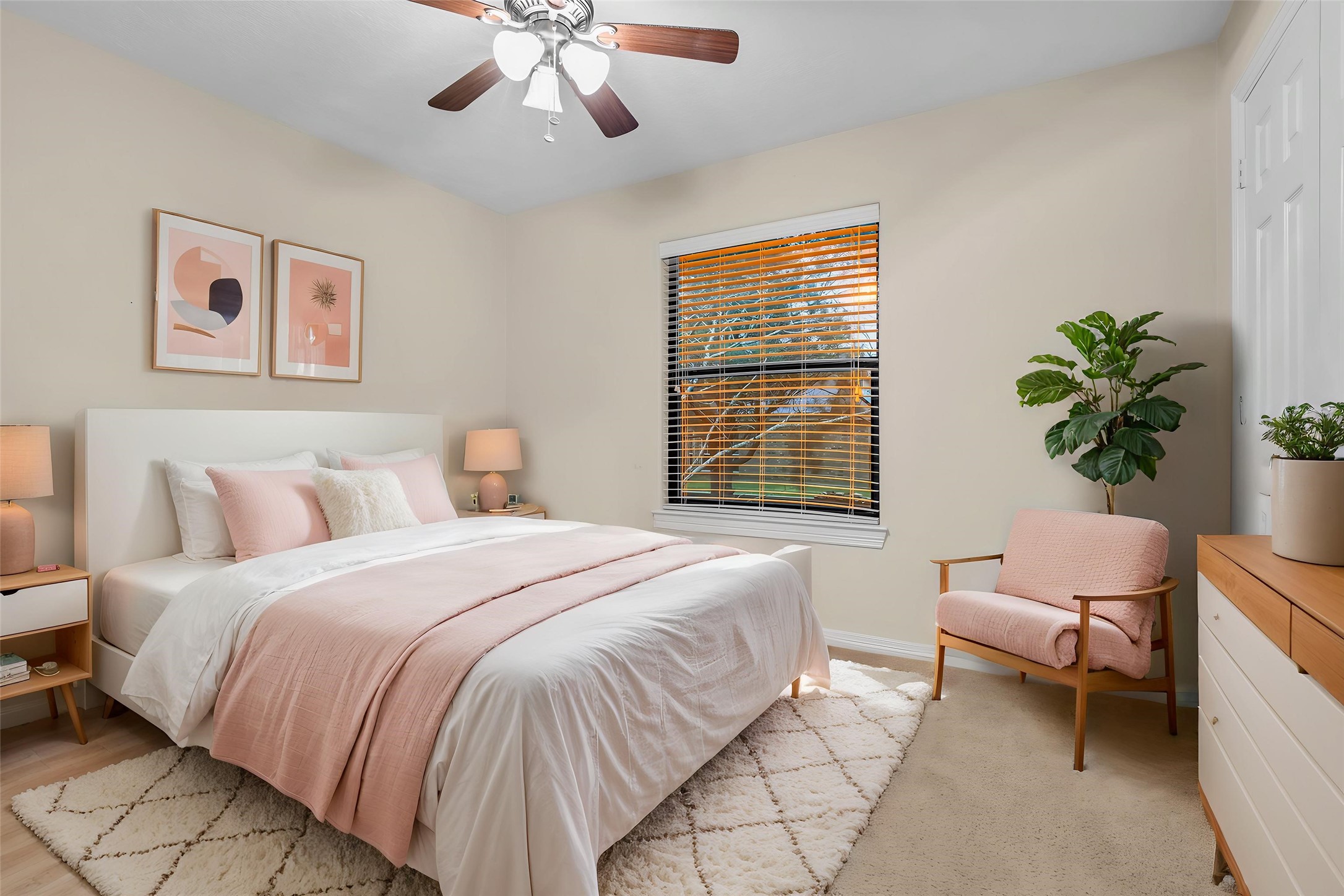 1898 Longmire Road, Unit 5 Conroe, TX 77304 - Photo 37 of 48 This virtually staged bedroom radiates warmth and elegance with its cozy, soft pink accents and inviting natural light, creating the perfect retreat.