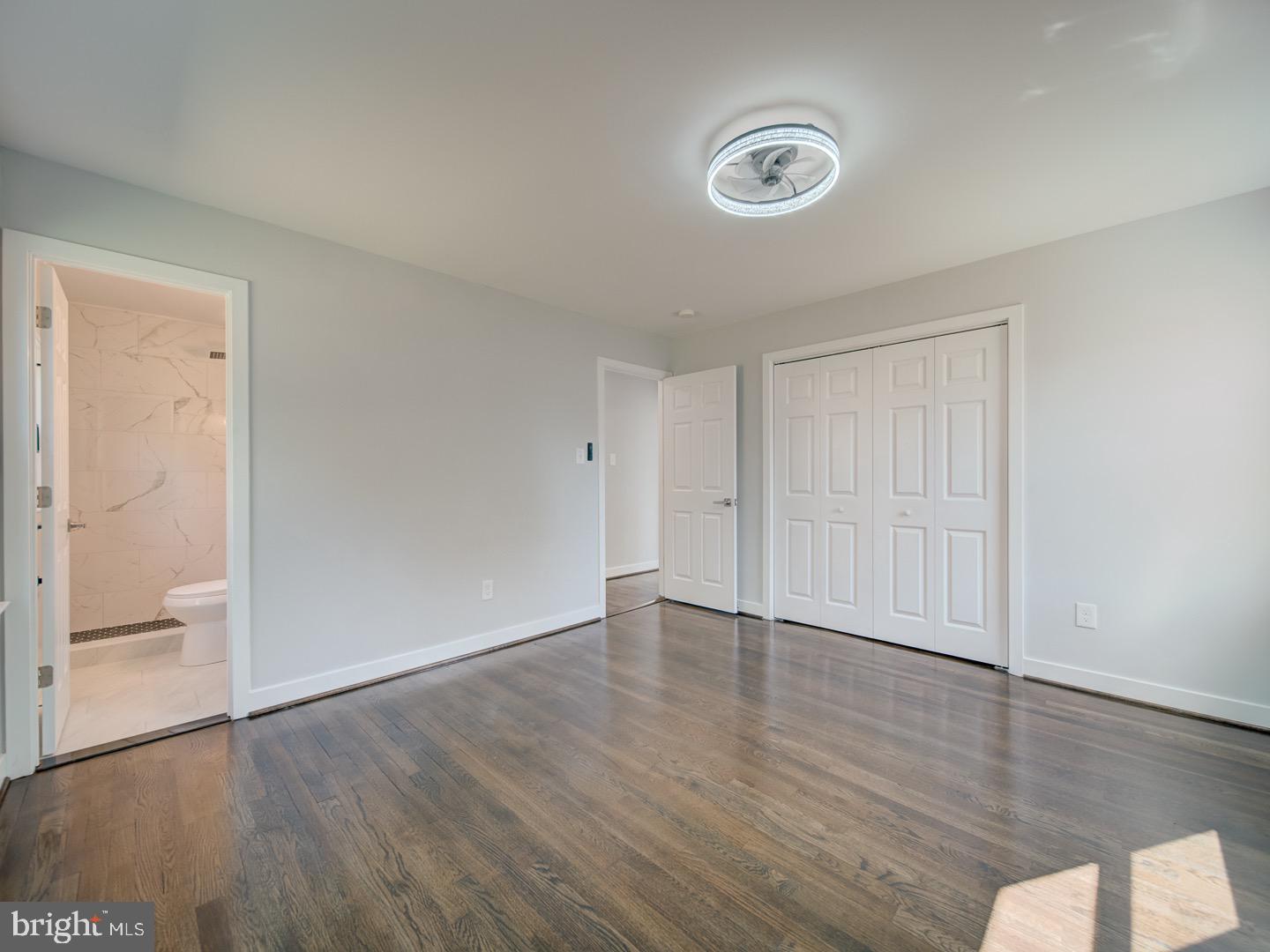 3812 Blackwater Road Clinton, MD 20735 - Photo 26 of 40 an empty room with wooden floor and windows