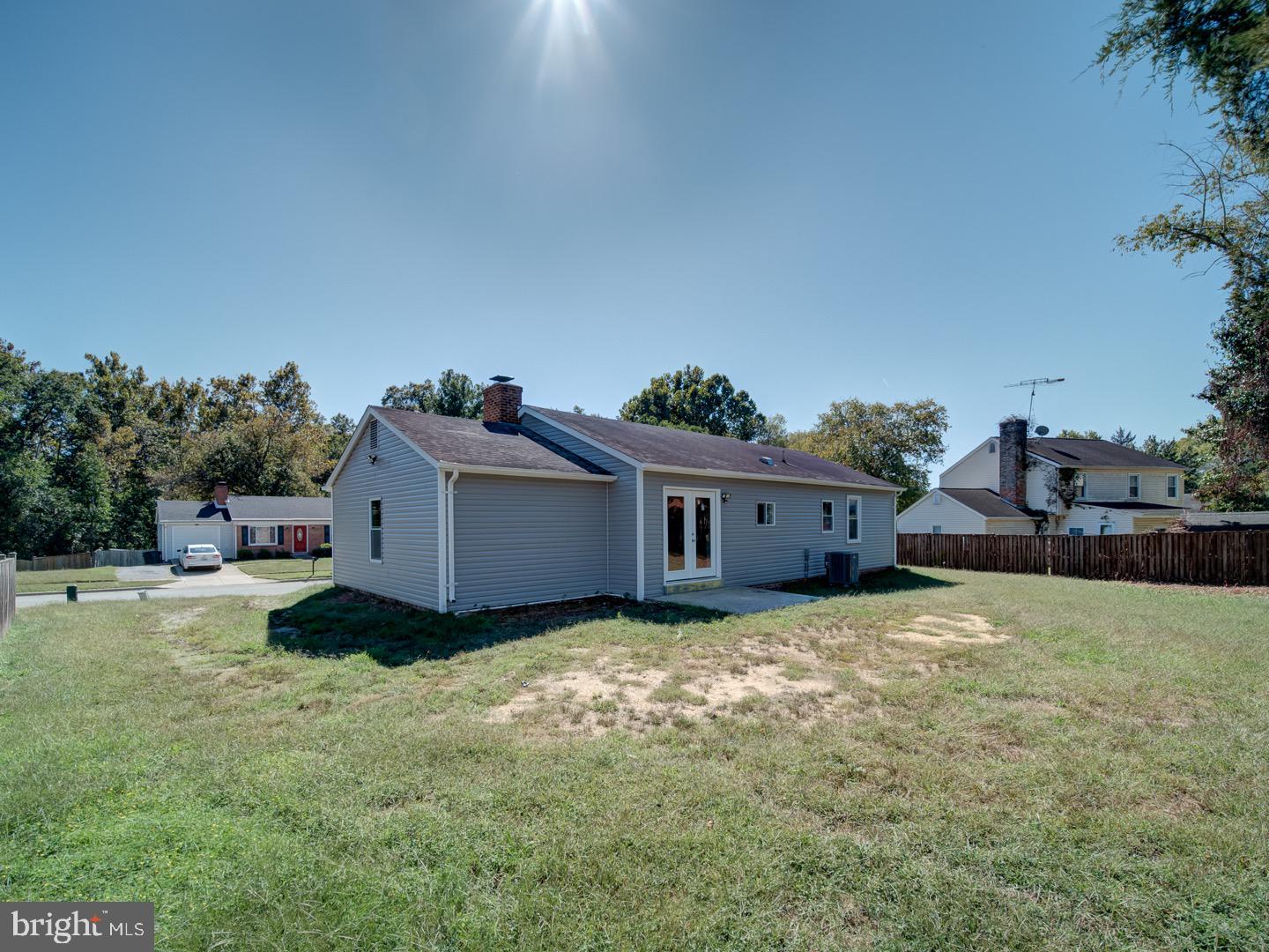 3812 Blackwater Road Clinton, MD 20735 - Photo 40 of 40 a backyard of a house with a yard and garage