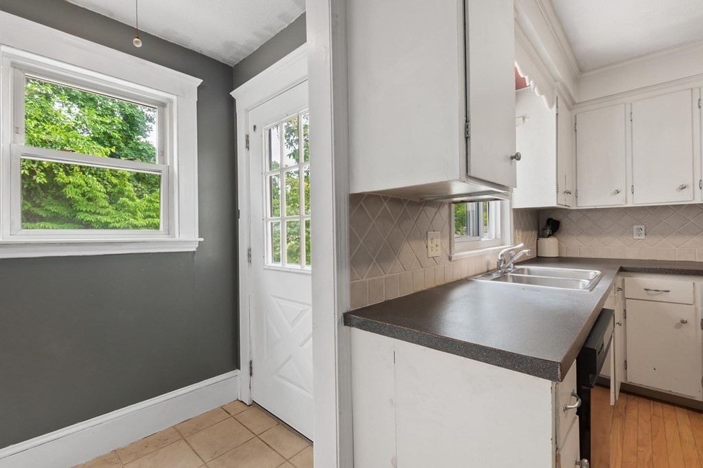 17 Columbia Road Danvers, MA 01923 - Photo 14 of 39 a kitchen with a sink a stove and cabinets