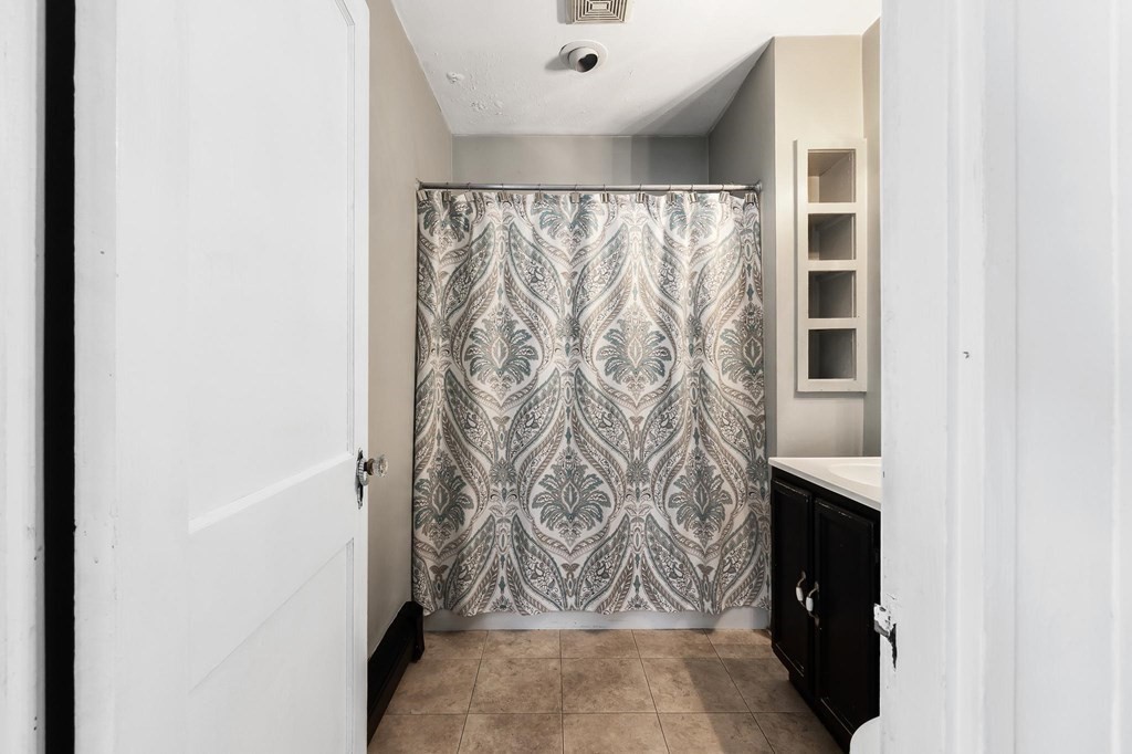 17 Columbia Road Danvers, MA 01923 - Photo 15 of 39 a bathroom with a shower and a tub