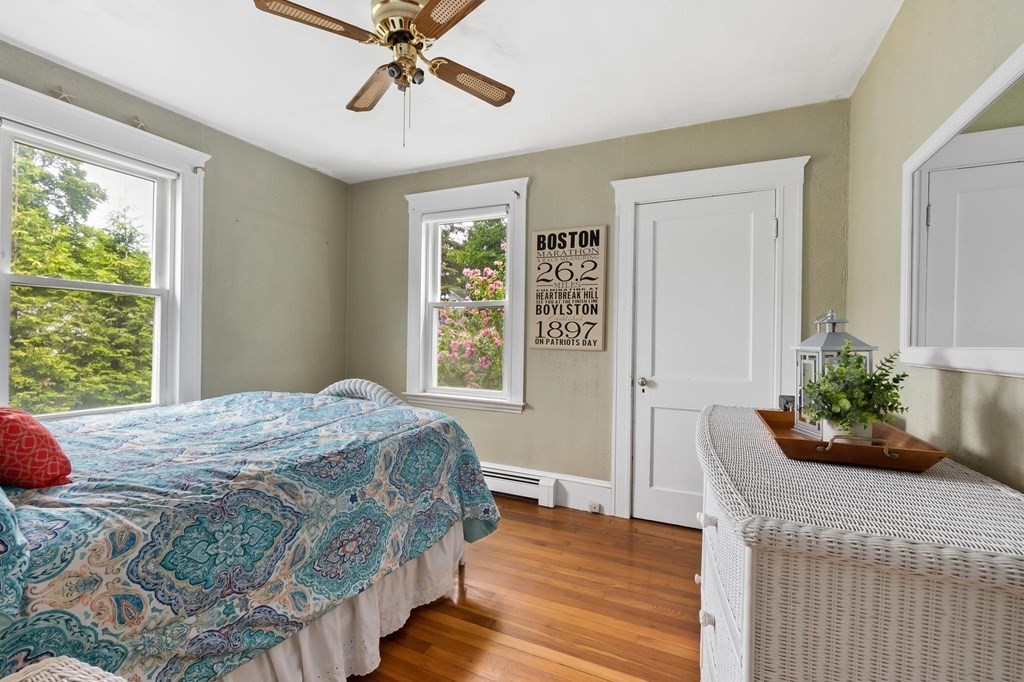 17 Columbia Road Danvers, MA 01923 - Photo 18 of 39 a bedroom with a bed and a potted plant