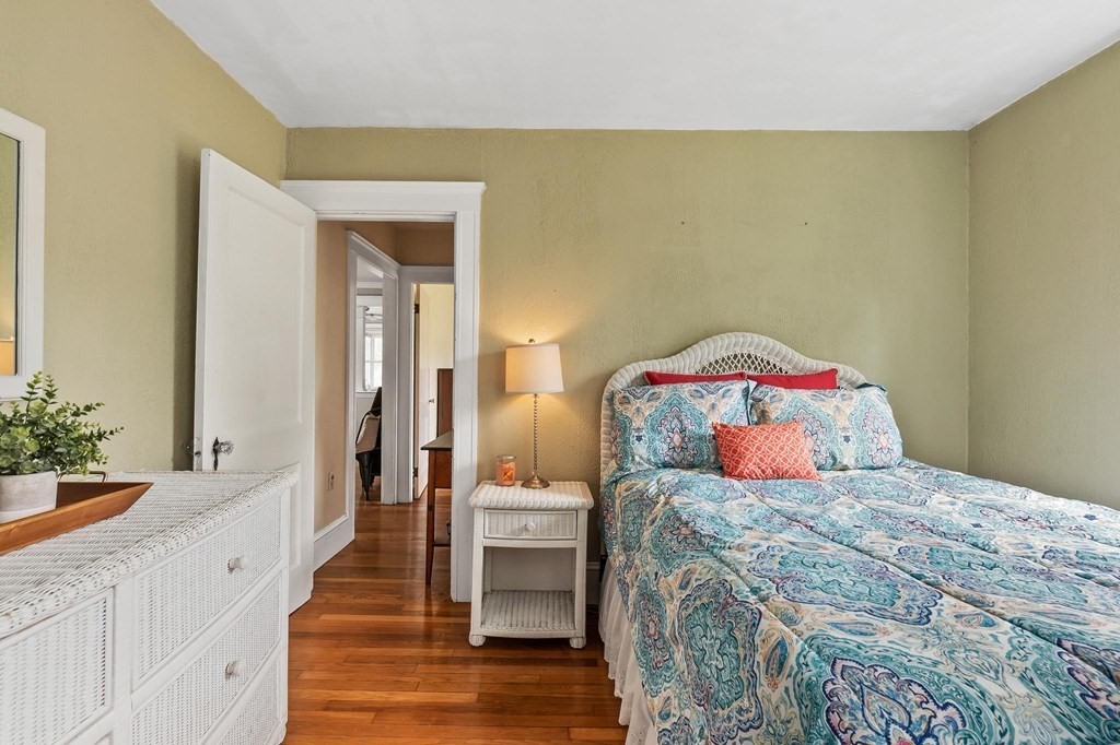 17 Columbia Road Danvers, MA 01923 - Photo 19 of 39 a bedroom with a bed and a potted plant