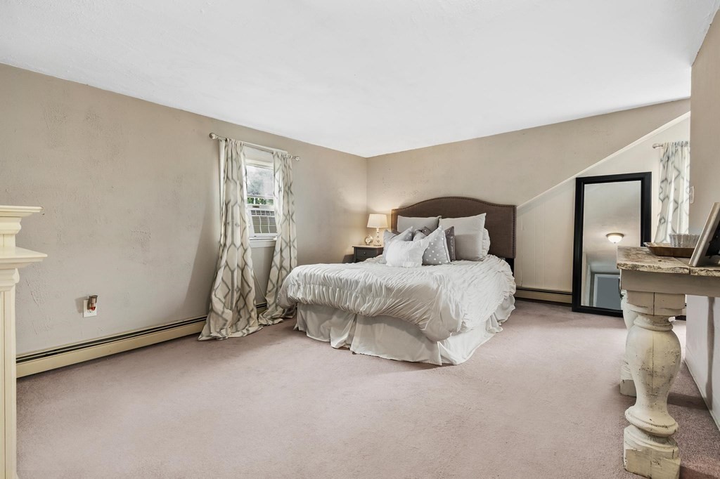 17 Columbia Road Danvers, MA 01923 - Photo 24 of 39 a bedroom with a bed and a tv