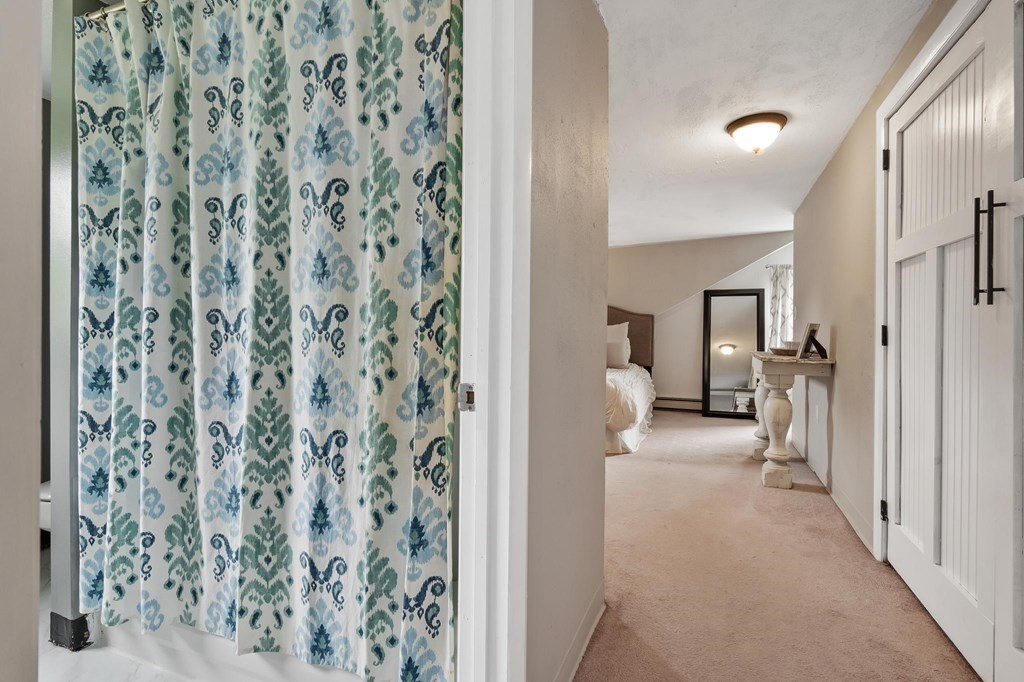17 Columbia Road Danvers, MA 01923 - Photo 28 of 39 a view of a hallway with a livingroom and a yard