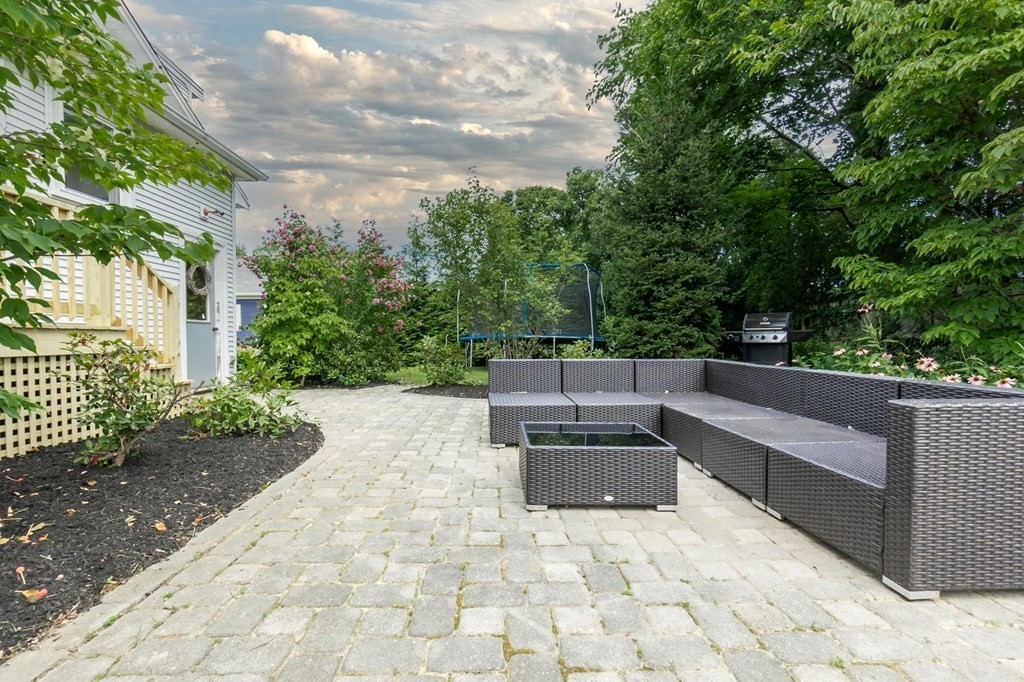 17 Columbia Road Danvers, MA 01923 - Photo 35 of 39 a view of a terrace with couches and wooden fence