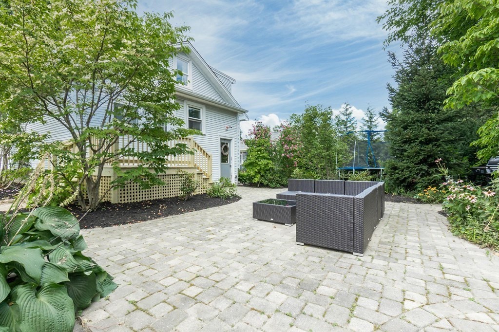 17 Columbia Road Danvers, MA 01923 - Photo 37 of 39 a backyard of a house with yard and outdoor seating