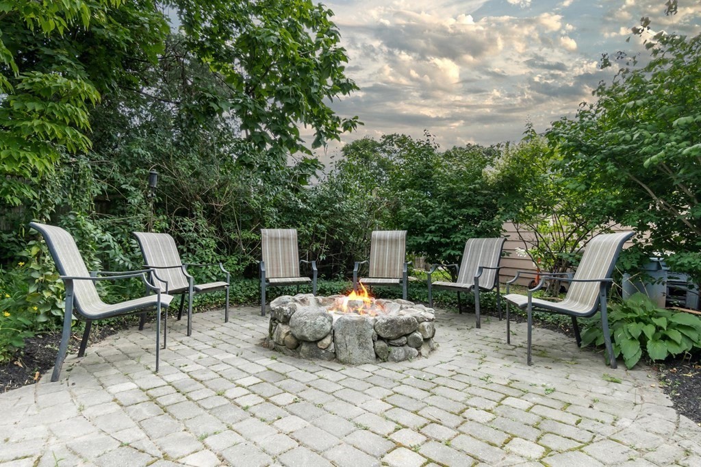 17 Columbia Road Danvers, MA 01923 - Photo 38 of 39 a row of chairs and a table in a patio