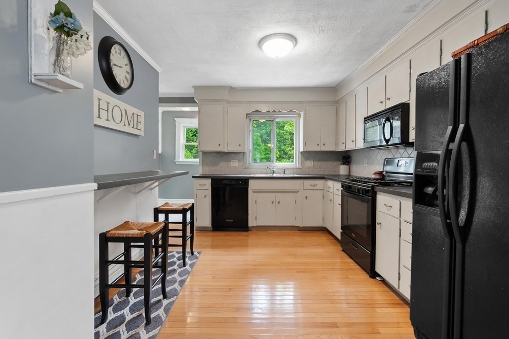 17 Columbia Road Danvers, MA 01923 - Photo 10 of 39 a kitchen with stainless steel appliances granite countertop a refrigerator and a stove top oven