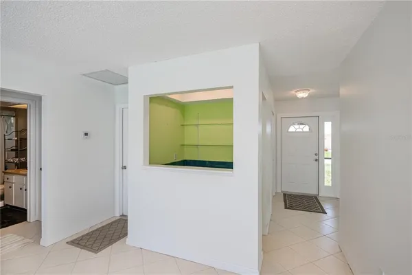 a view of hallway with bathroom
