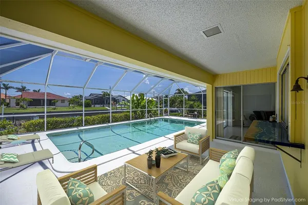 a bedroom with a bed and a view of balcony