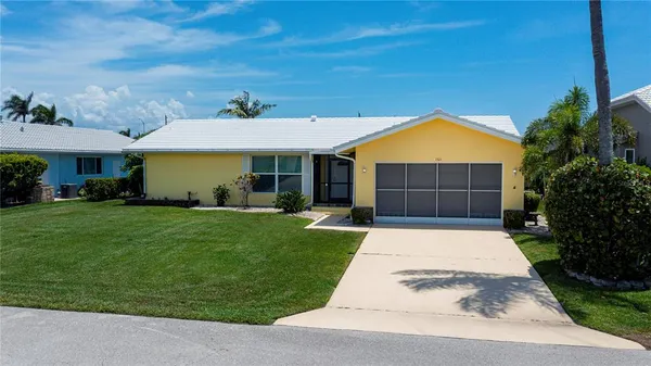 an aerial view of a house yard swimming pool and outdoor seating