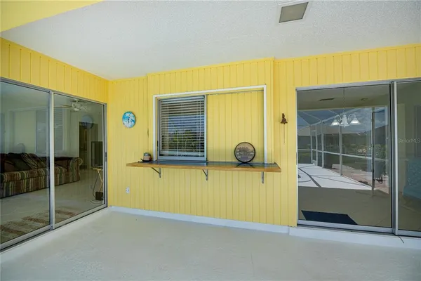 a swimming pool with outdoor seating