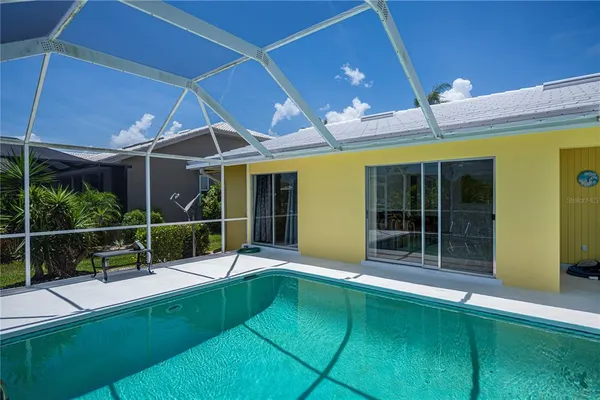 a view of a lake with a house in the background