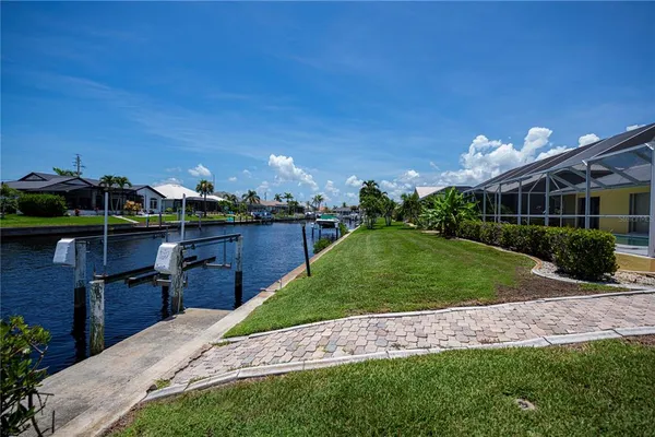 a view of a lake with a house in the background