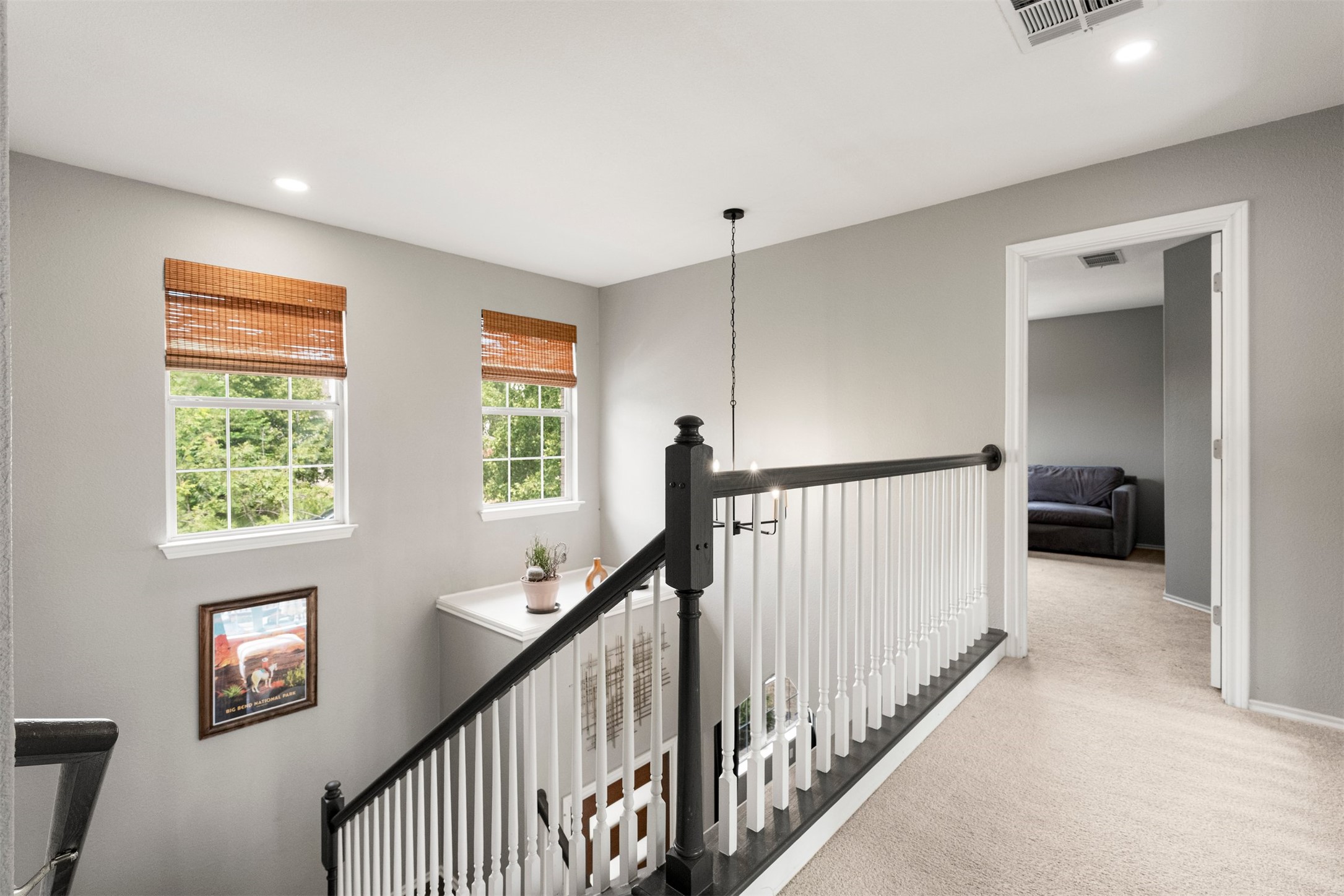 7009 Wandering Oak Road Austin, TX 78749 - Photo 26 of 36 The open upstairs walkway overlooks the main living area below, creating a unique vantage point with light pouring in from multiple windows