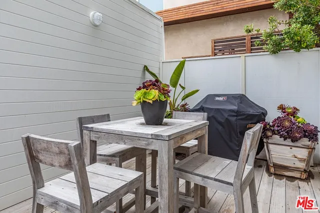 a view of a chairs and table in a patio