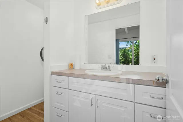 a bathroom with a sink and a mirror