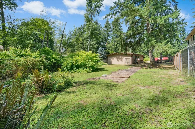 a view of a house with a fence