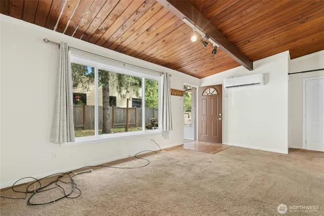 a view of an empty room with a window