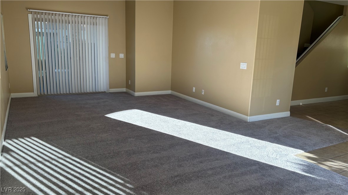 9473 Alma Ridge Avenue Las Vegas, NV 89178 - Photo 10 of 35 Empty room featuring carpet flooring