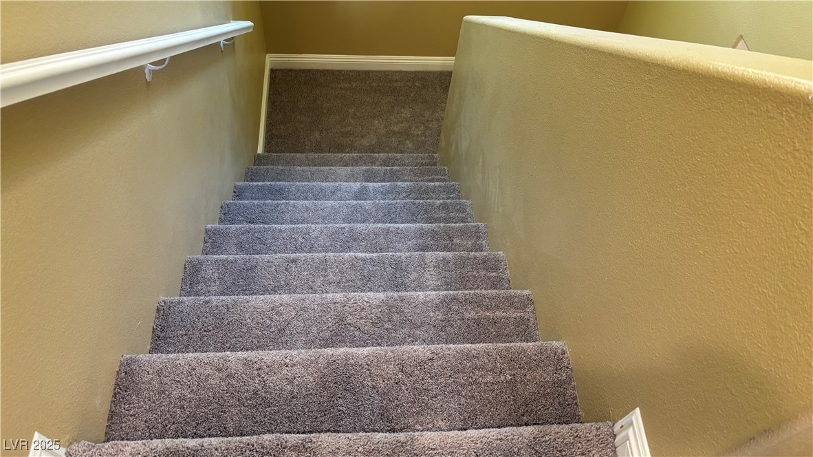 9473 Alma Ridge Avenue Las Vegas, NV 89178 - Photo 20 of 35 Stairs with a textured wall