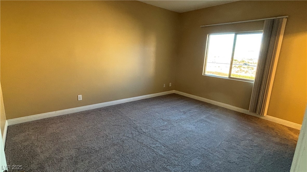 9473 Alma Ridge Avenue Las Vegas, NV 89178 - Photo 21 of 35 Unfurnished room featuring dark carpet