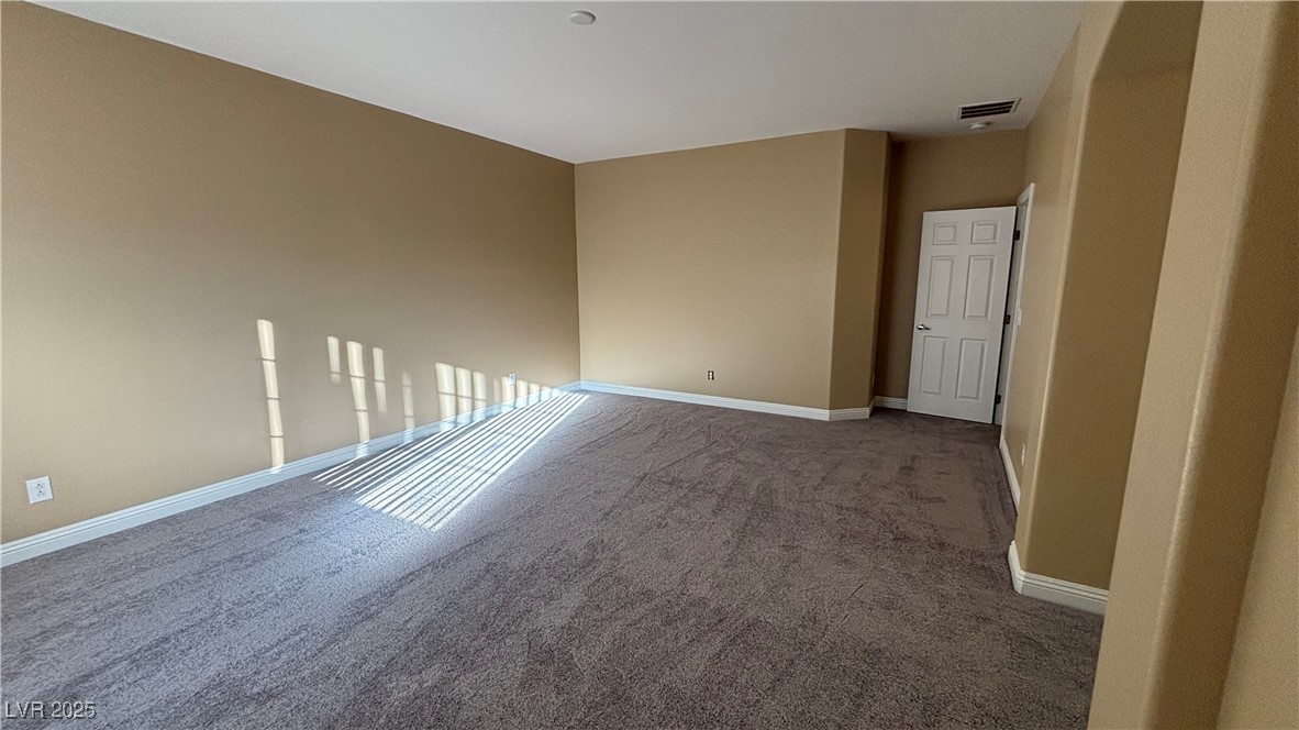 9473 Alma Ridge Avenue Las Vegas, NV 89178 - Photo 27 of 35 Unfurnished room with carpet floors and baseboards