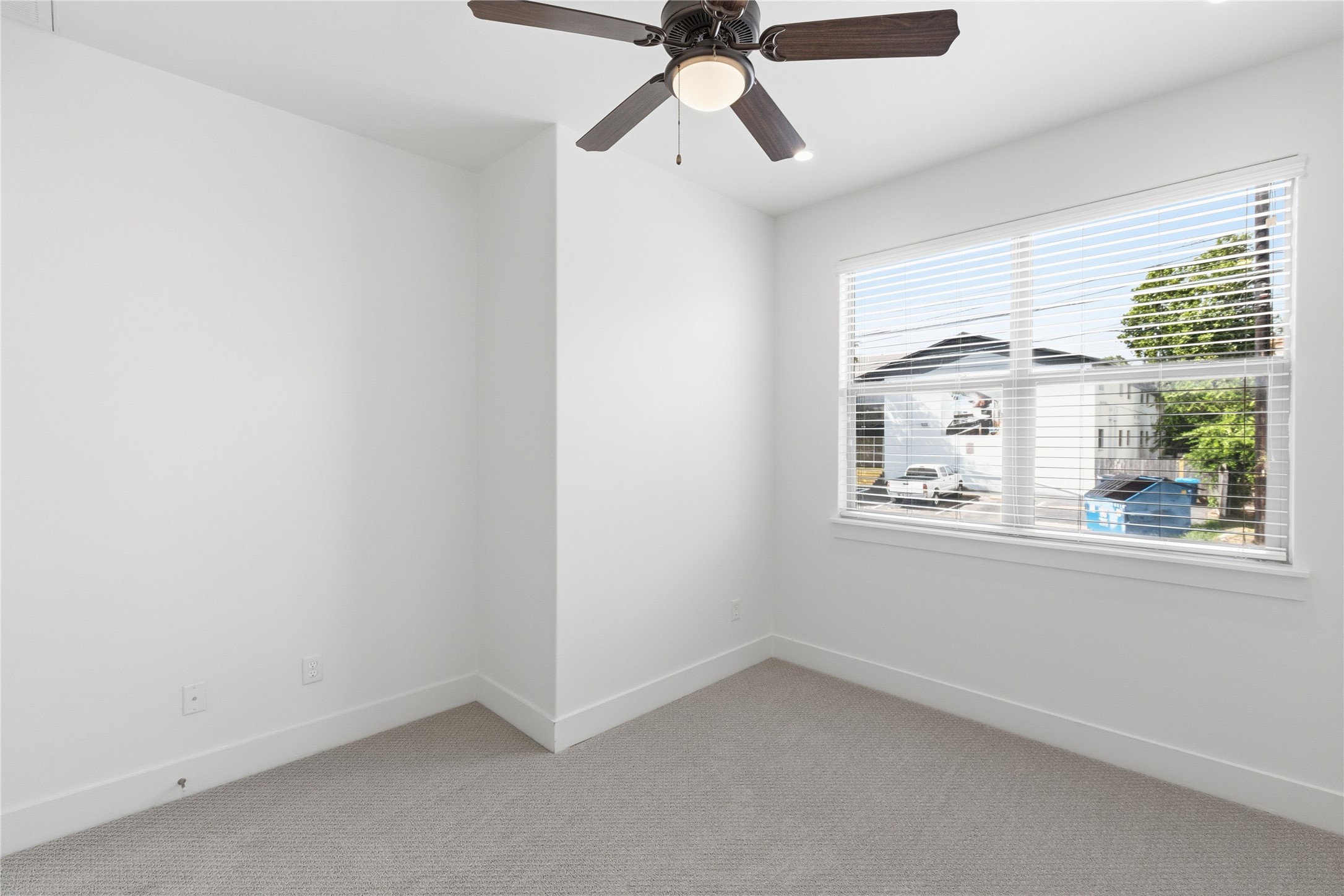 4124 Valley View Road, Unit 4A & 4B Austin, TX 78704 - Photo 36 of 40 A well-lit bedroom features plush carpeting and a modern ceiling fan, offering comfortable living.