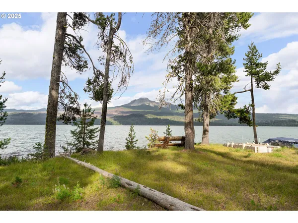 a view of swimming pool with lake view and mountain view