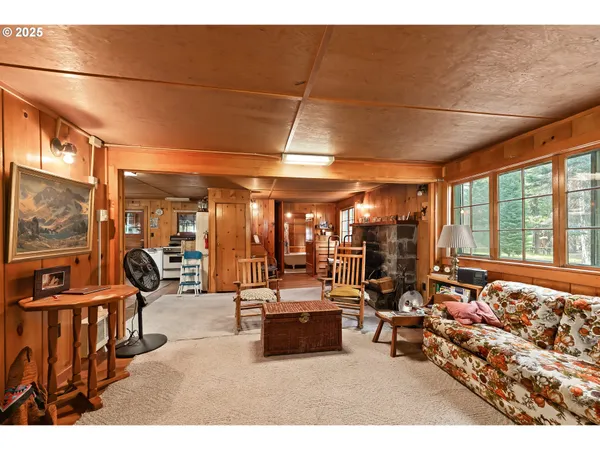 a view of a livingroom with furniture and a fireplace
