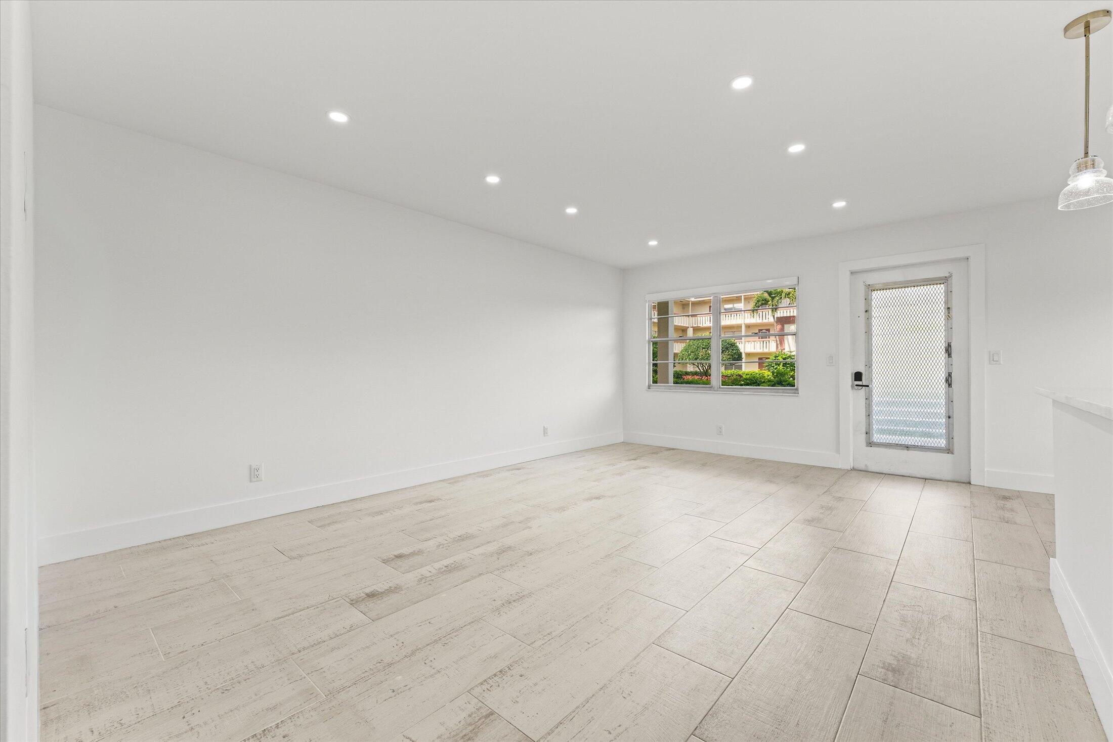 308 Preston H, Unit 308 Boca Raton, FL 33434 - Photo 11 of 22 a view of an empty room with a window