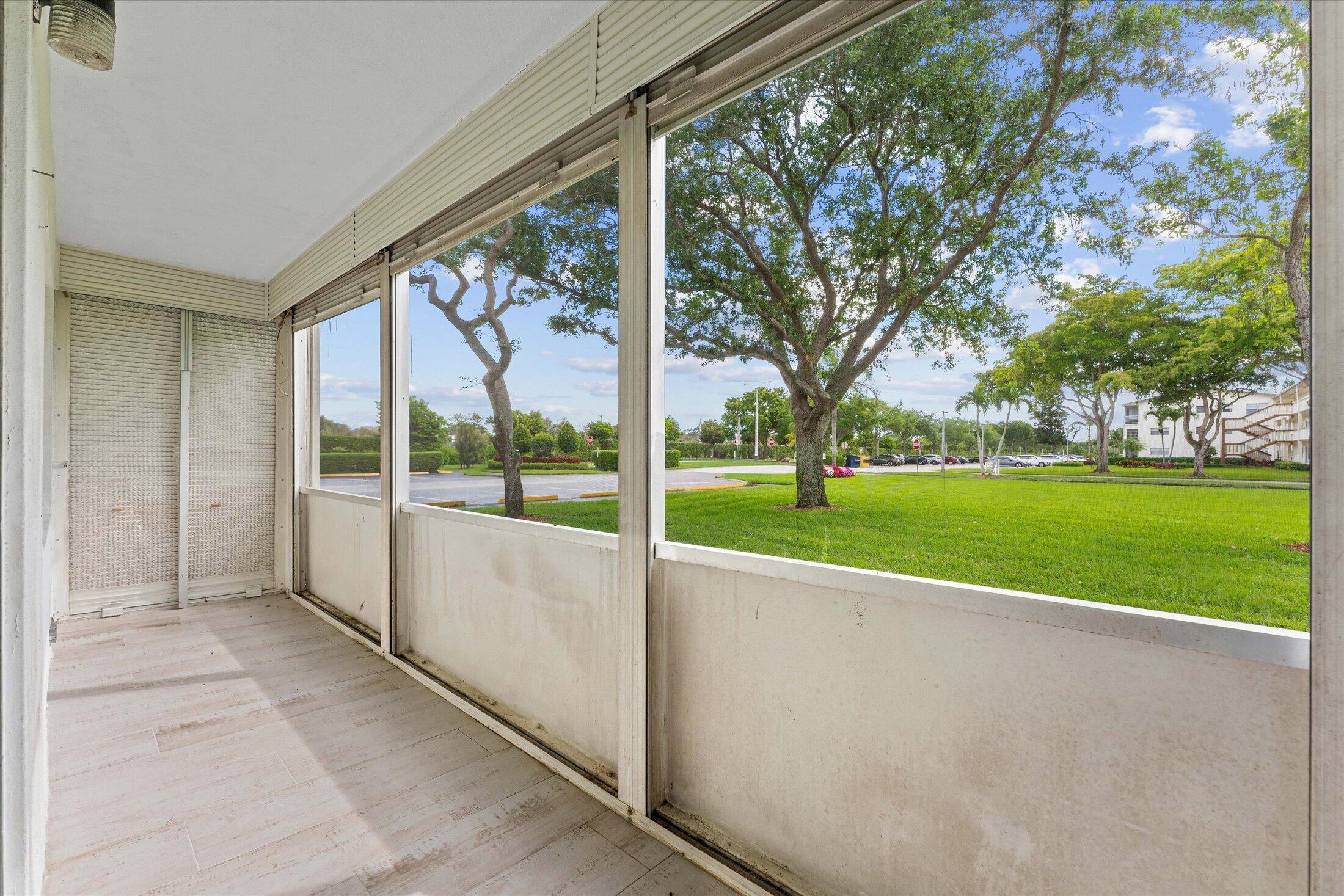 308 Preston H, Unit 308 Boca Raton, FL 33434 - Photo 19 of 22 a view of an outdoor space with a garden