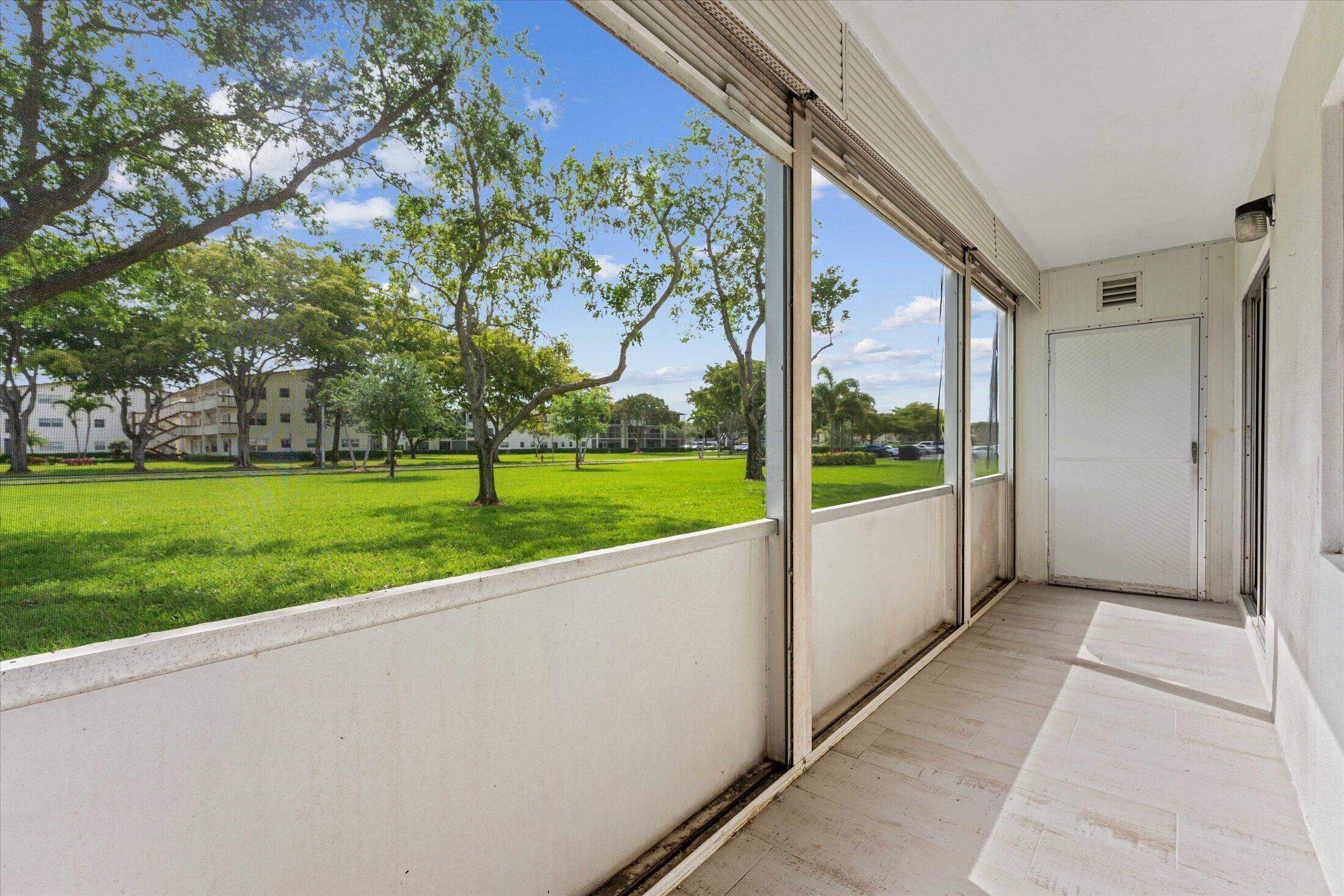 308 Preston H, Unit 308 Boca Raton, FL 33434 - Photo 20 of 22 a view of outdoor space and yard