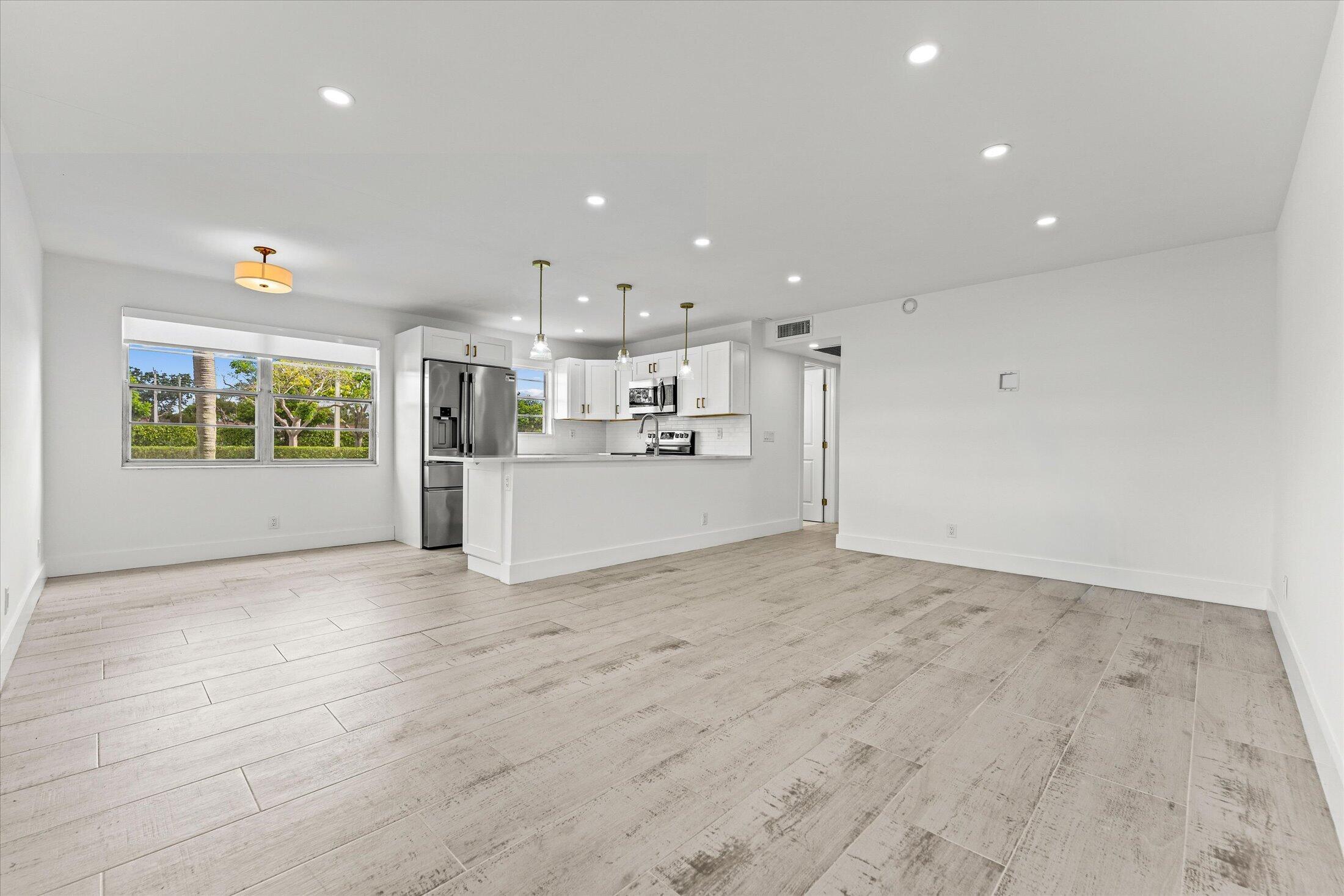 308 Preston H, Unit 308 Boca Raton, FL 33434 - Photo 22 of 22 a view of a kitchen with a stove
